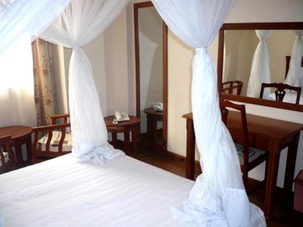 Arusha Tourist Inn Hotel Стая снимка
